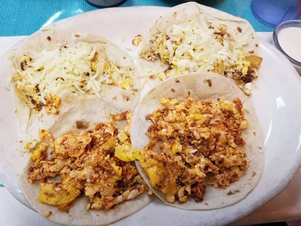 2 Potato Bacon and Cheese Tacos and 2 Chorizo and Egg Tacos